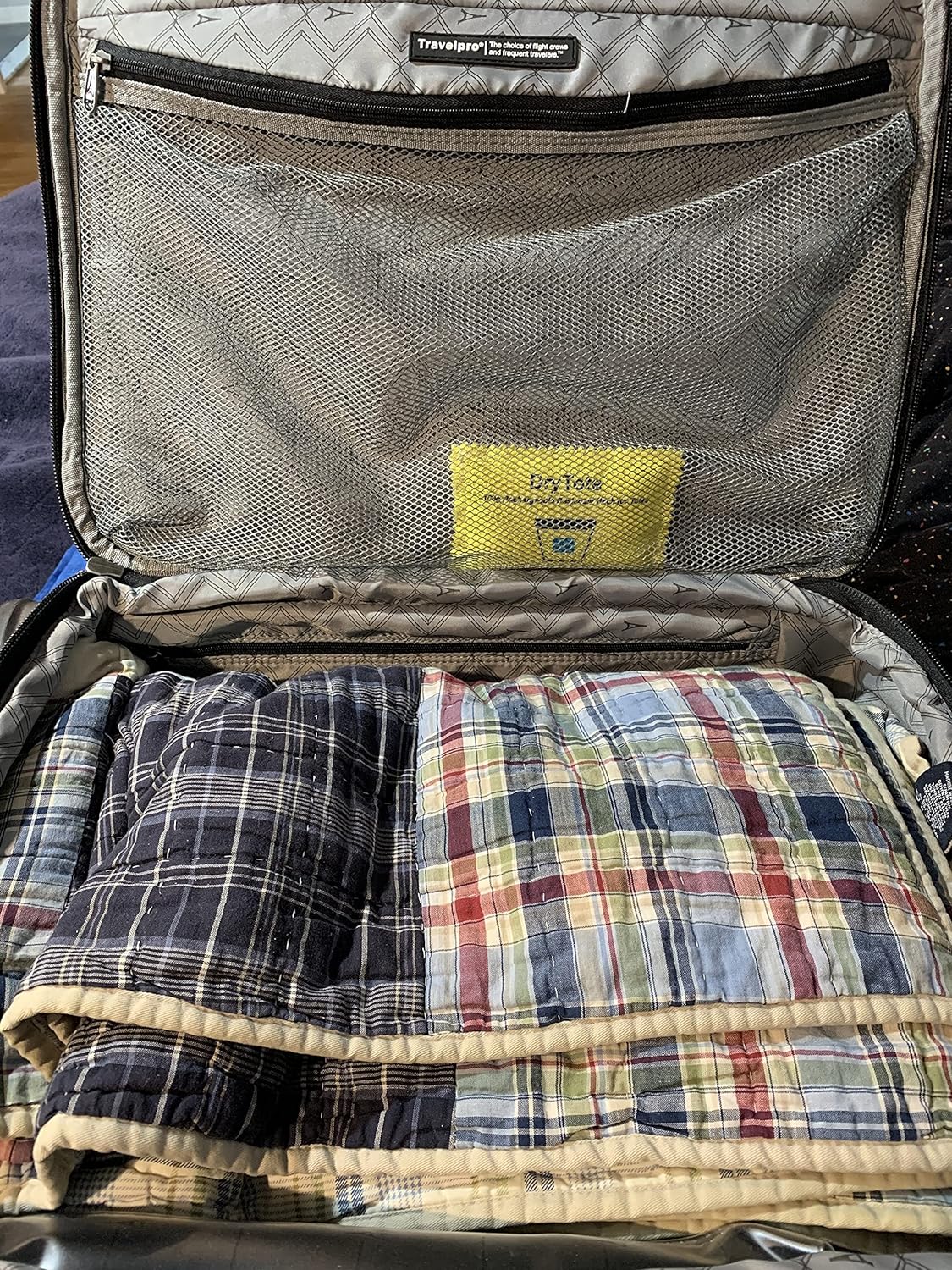 Wisedry 100g rechargeable desiccant pack with a flat fabric body and handle loop, sized to sit in an open gear-case slot without being crushed