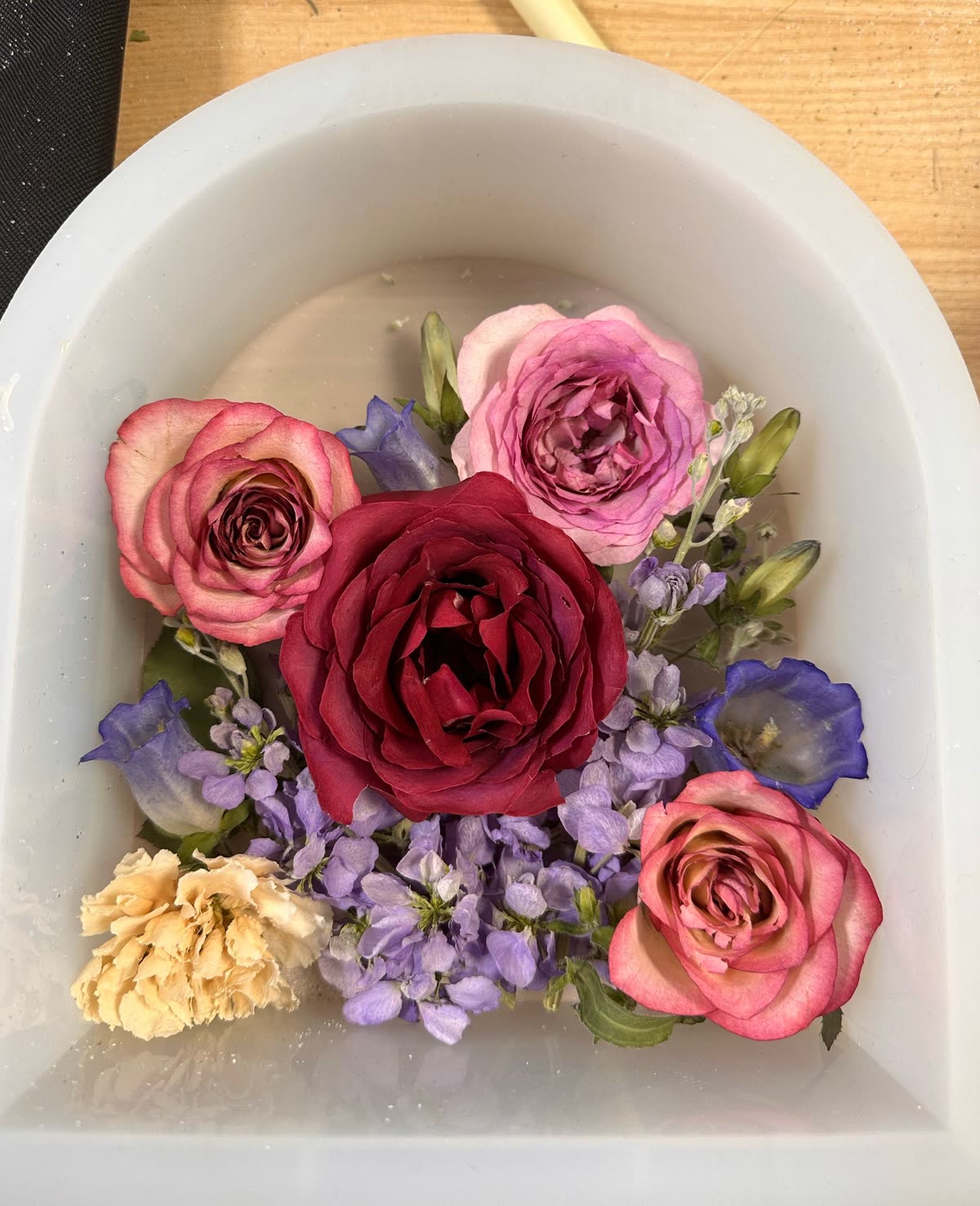 Fresh flowers soaking in water before drying and resin preservation