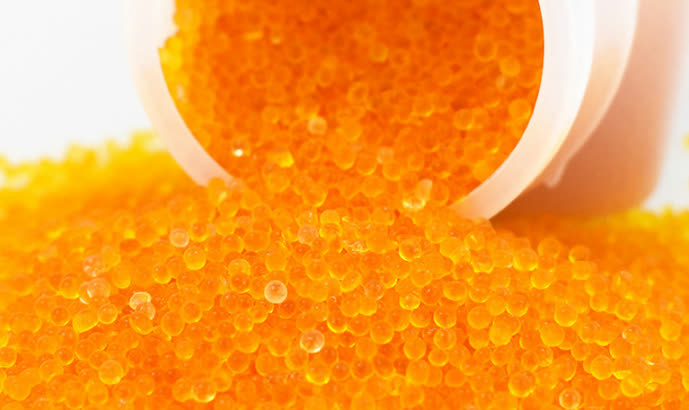 Orange indicating silica gel beads for moisture absorber comparison