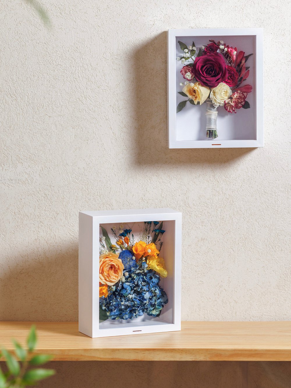 Preserved flowers arranged in a shadow box keepsake