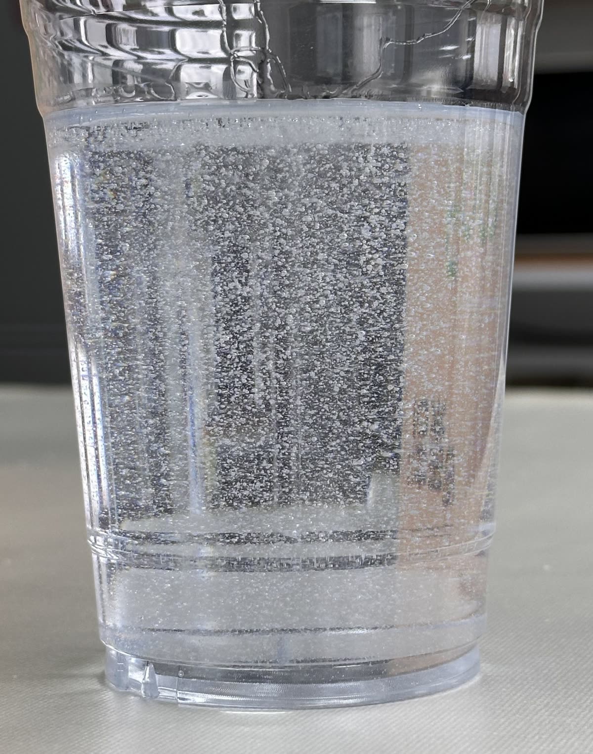 Silica gel desiccant packet submerged in water during a bubble test