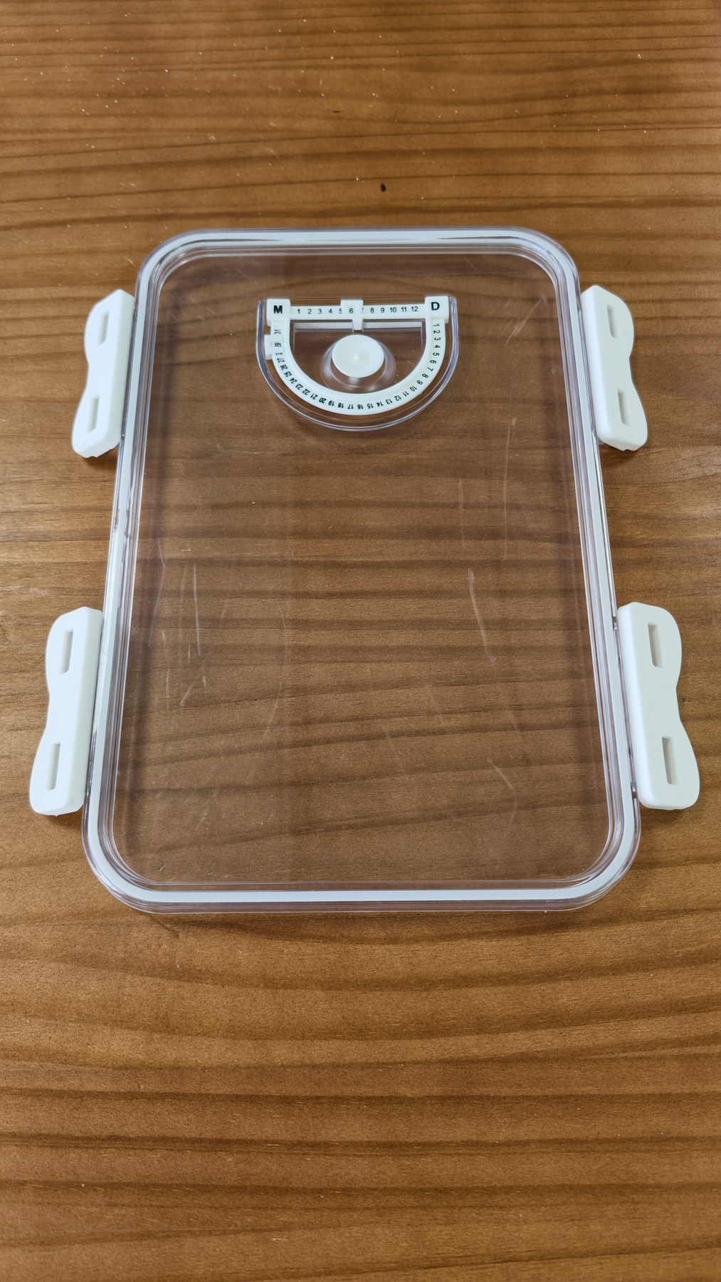 Clear Wisedry flower drying lid with white clips checked before closing the container